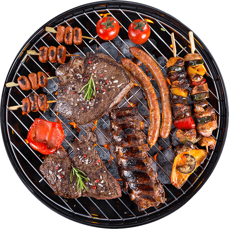 Platter of grilled meats and vegetables on a round charcoal grill